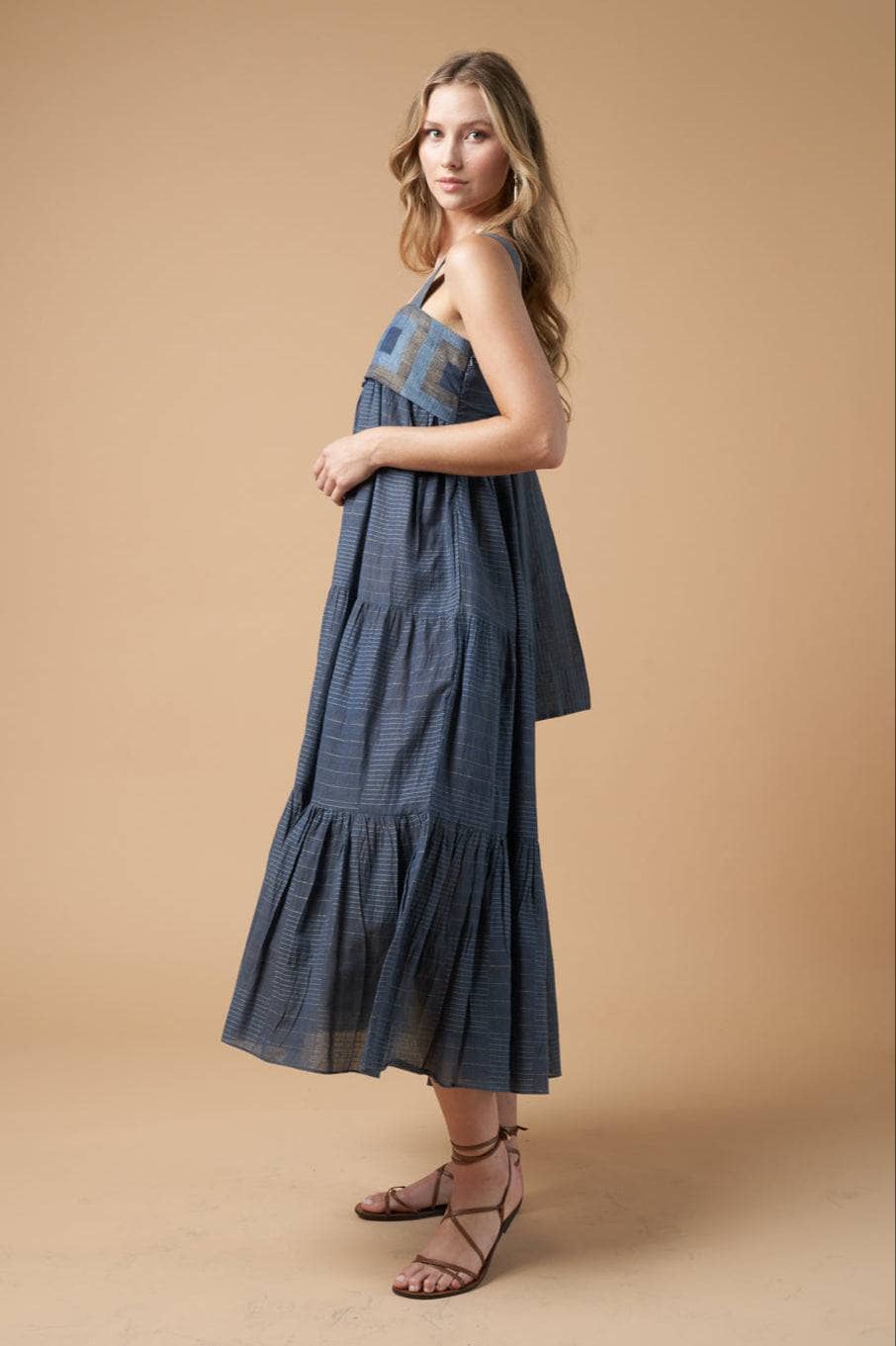 Model wearing the Isabella Denim Blue dress from Guadalupe Design.