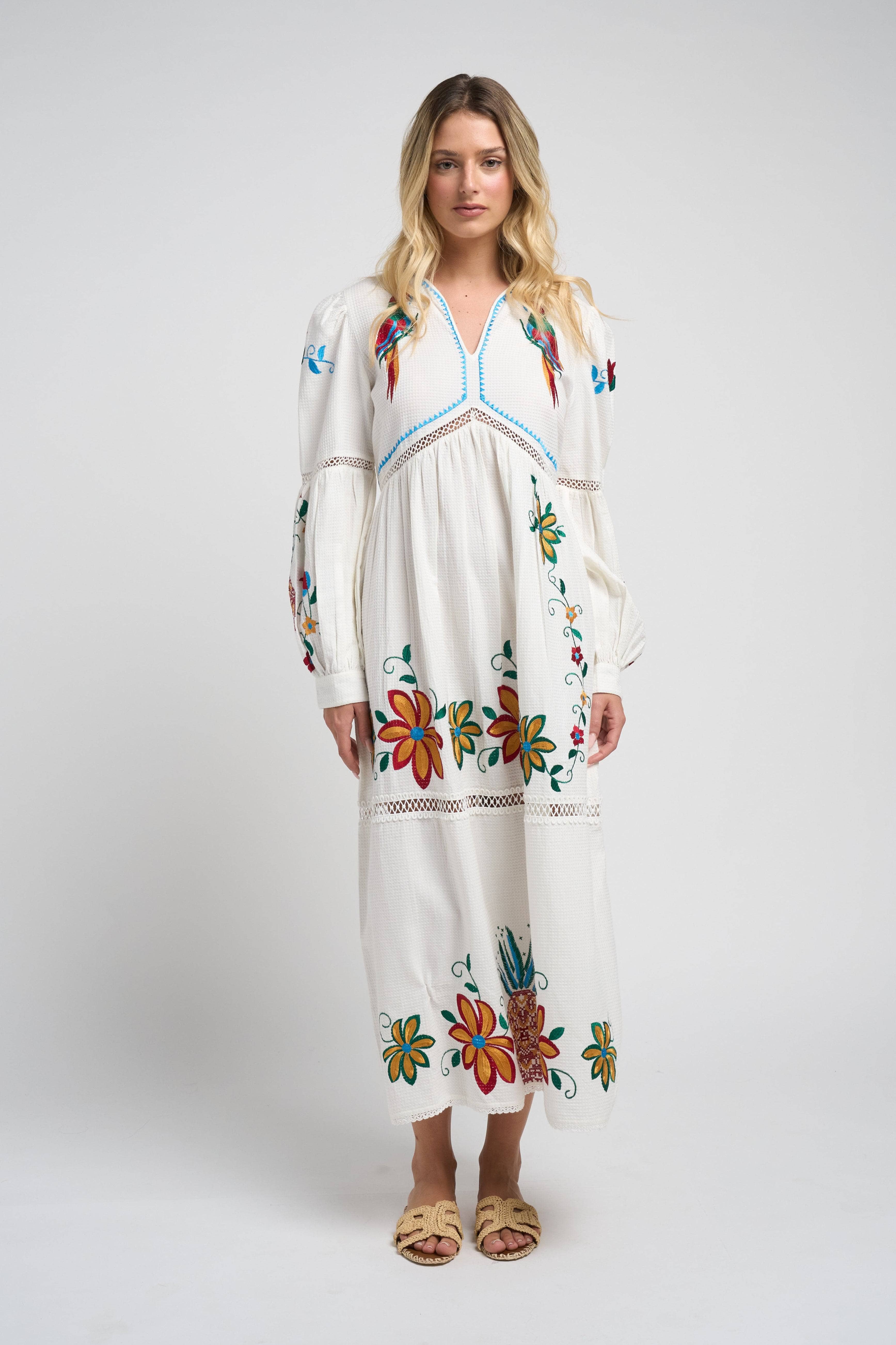 Sofia Parrot Dress, showcasing its tropical parrot design.