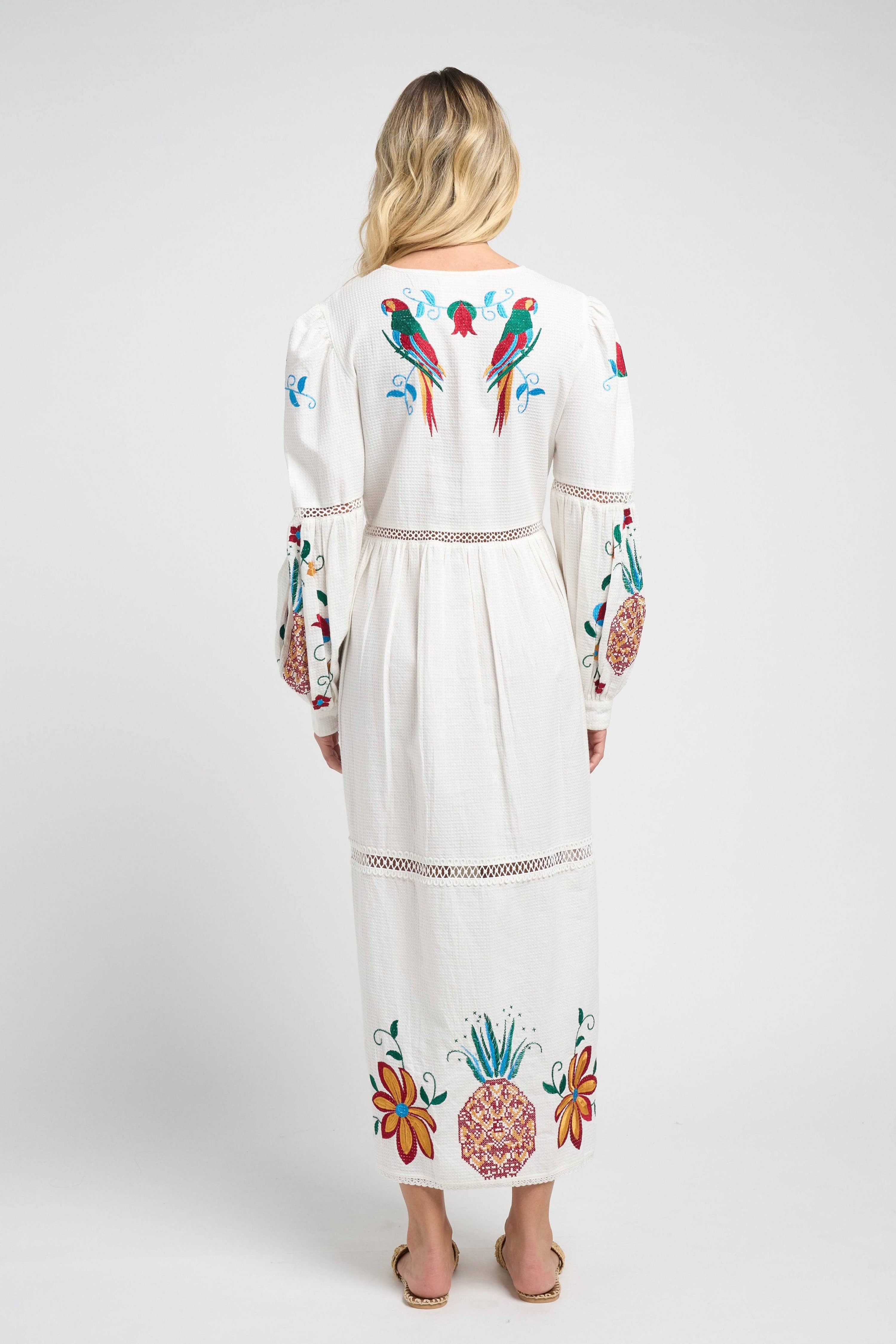 Model wearing the vibrant Sofia Parrot Dress
